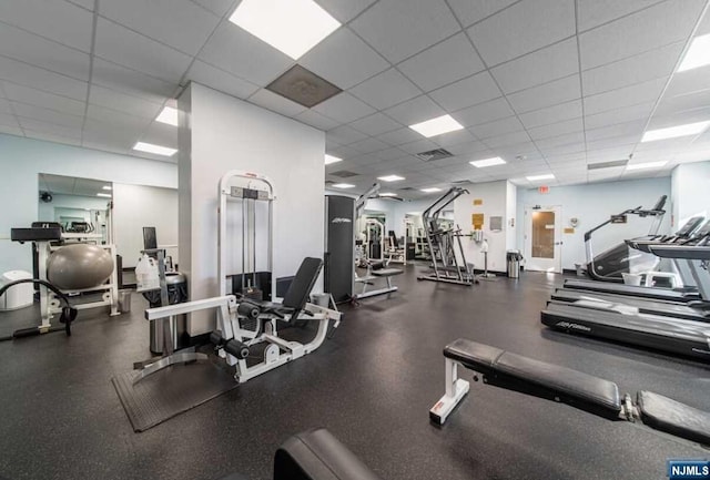 exercise room featuring a paneled ceiling