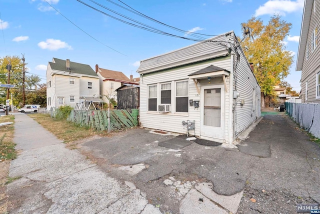 view of front of home with cooling unit