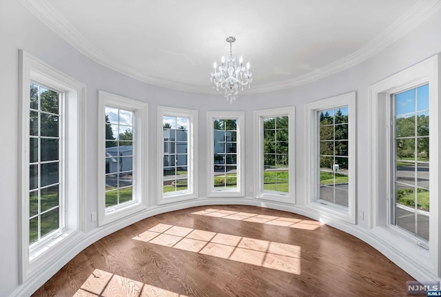 unfurnished sunroom featuring a notable chandelier