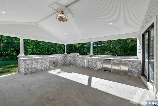 view of patio / terrace featuring a grill and exterior kitchen