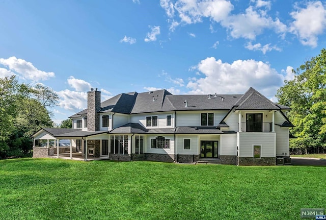 back of house featuring a patio, central air condition unit, and a lawn