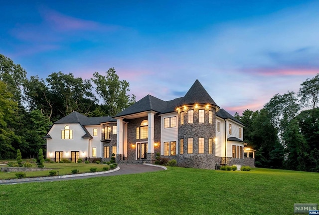 view of front of home with a lawn