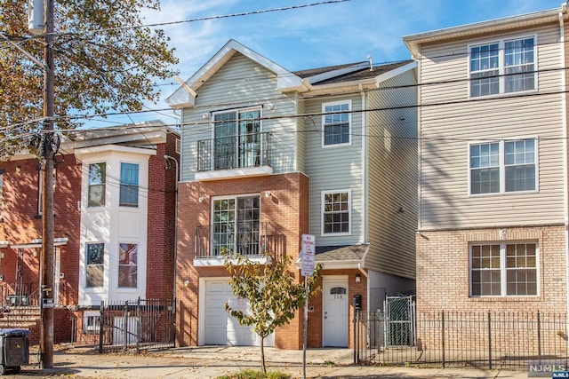 multi unit property featuring a garage