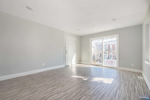 empty room featuring light hardwood / wood-style floors