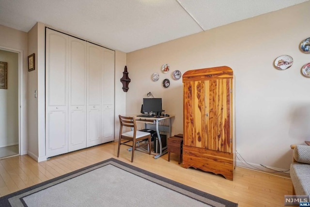 office area with light hardwood / wood-style floors