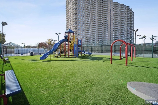 view of playground featuring a lawn