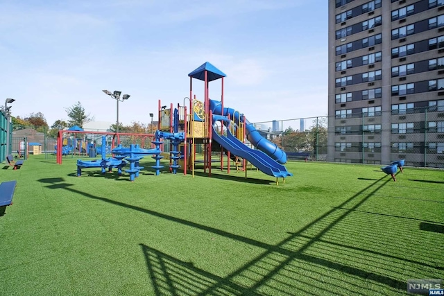 view of play area featuring a lawn