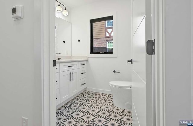 bathroom with vanity and toilet