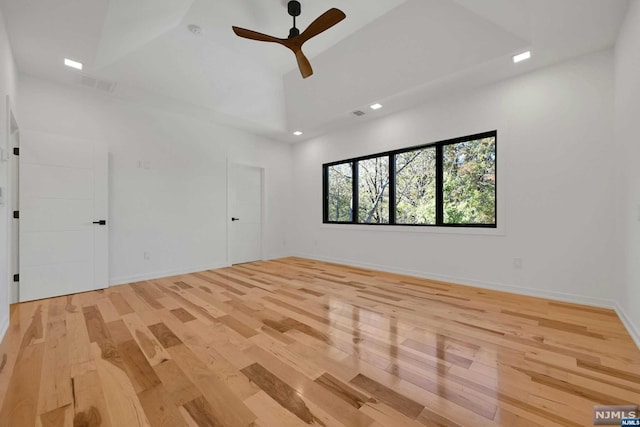 spare room with ceiling fan and light hardwood / wood-style floors