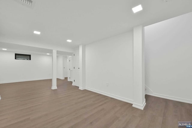 basement featuring wood-type flooring