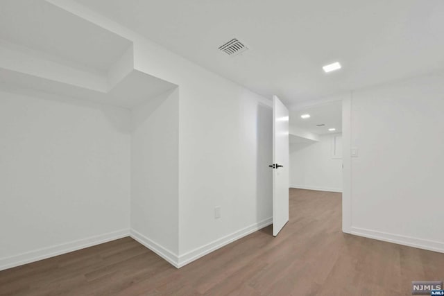 bonus room featuring dark hardwood / wood-style flooring