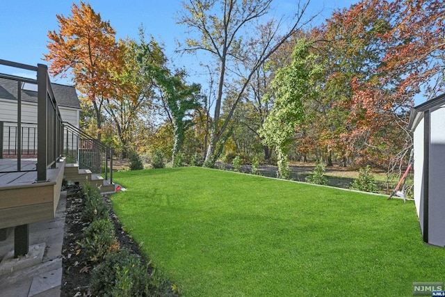 view of yard with glass enclosure