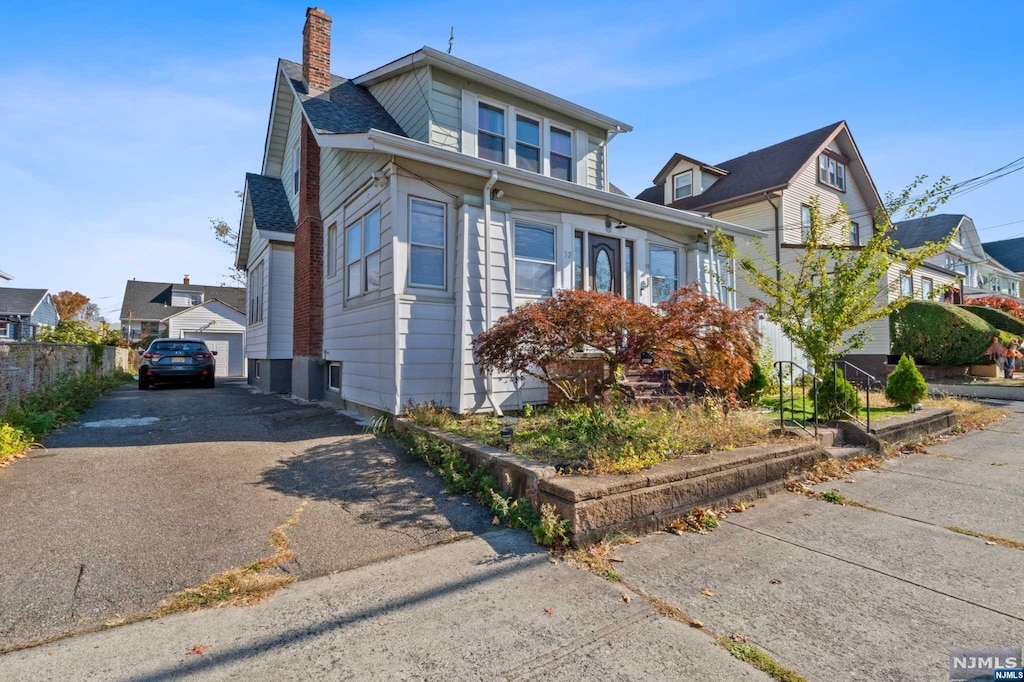 32-34 Arlington Ave, Paterson, NJ 07502 - view of front of home with a garage and an outdoor structure