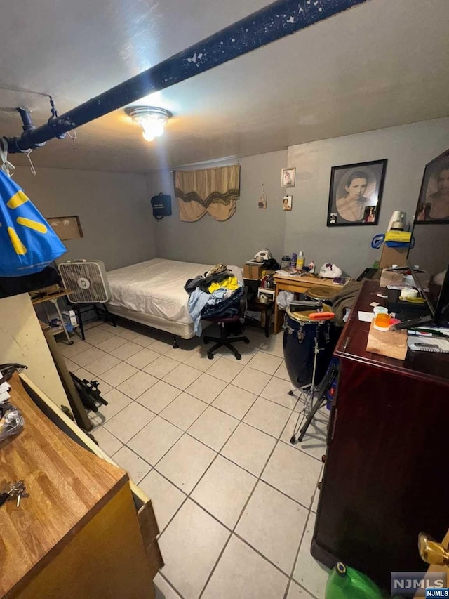 bedroom with light tile patterned floors