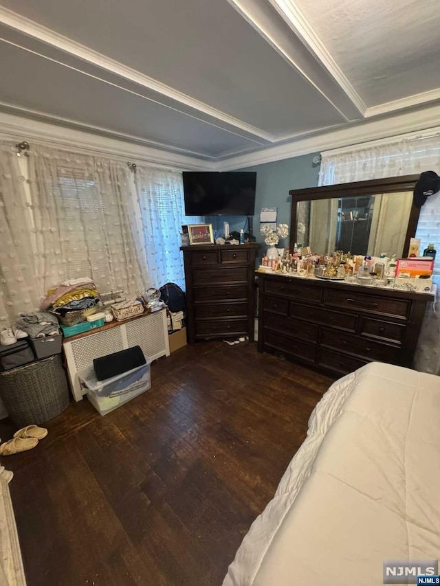 bedroom featuring dark hardwood / wood-style floors and ornamental molding