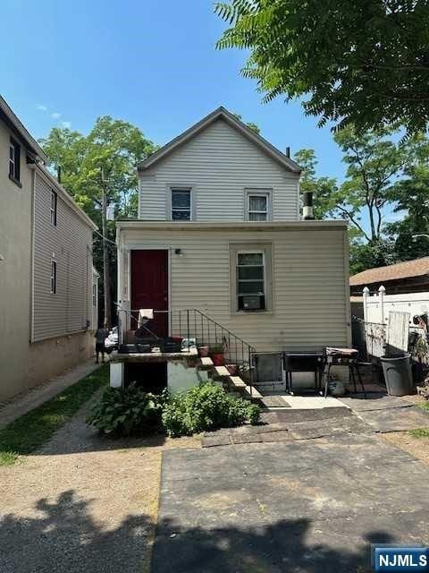 rear view of property featuring a patio