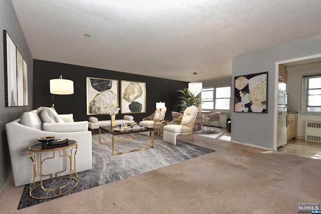 living room featuring radiator heating unit and carpet floors