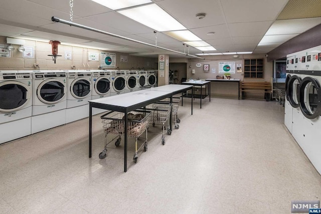 washroom featuring washing machine and dryer