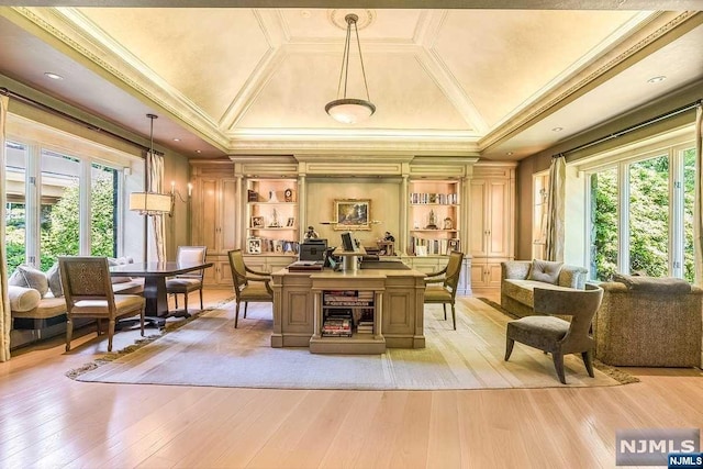 interior space featuring built in shelves, light hardwood / wood-style floors, and crown molding