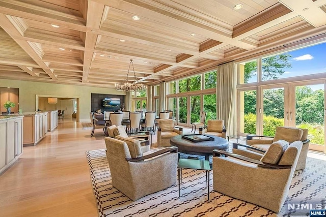 interior space with wooden ceiling, coffered ceiling, beamed ceiling, a chandelier, and light hardwood / wood-style floors