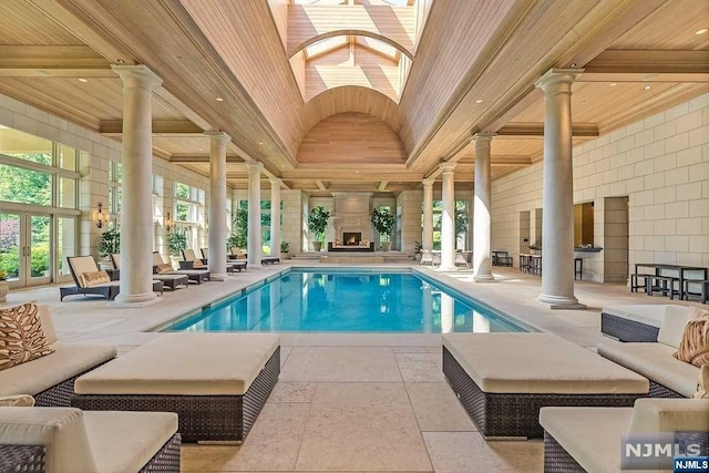 view of pool featuring a skylight