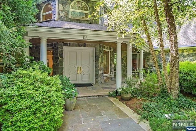 doorway to property featuring covered porch