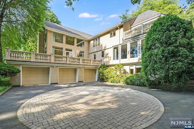 back of property with a balcony