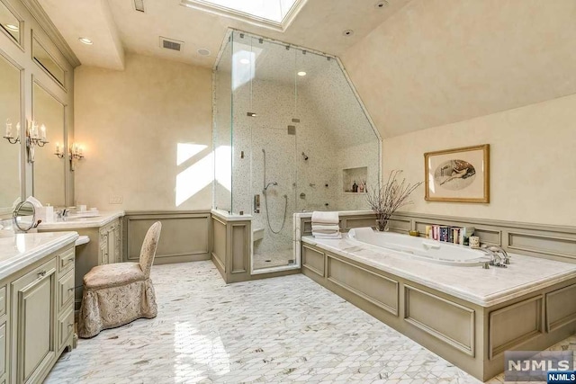 bathroom featuring vanity and separate shower and tub