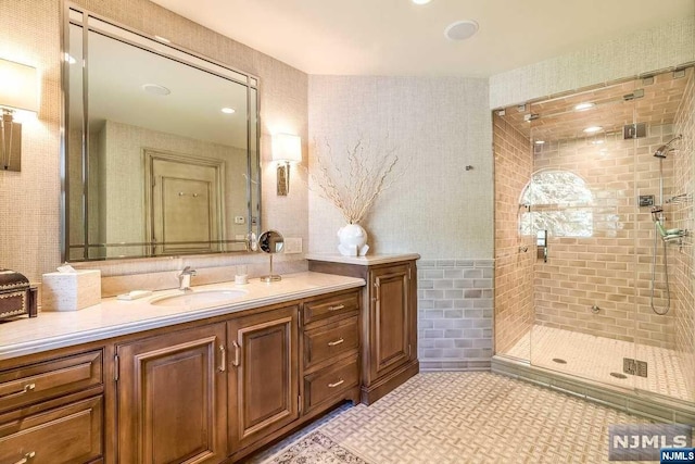 bathroom with vanity and an enclosed shower