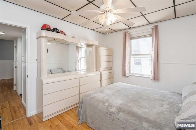 bedroom with ceiling fan and light wood-type flooring