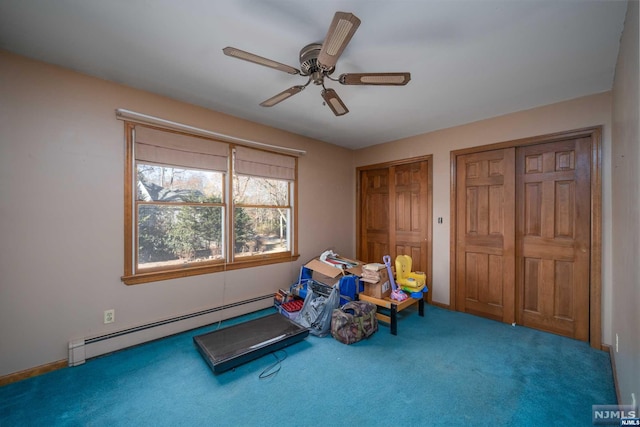 rec room featuring carpet, a baseboard heating unit, and ceiling fan