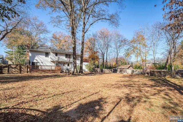 view of yard with a wooden deck