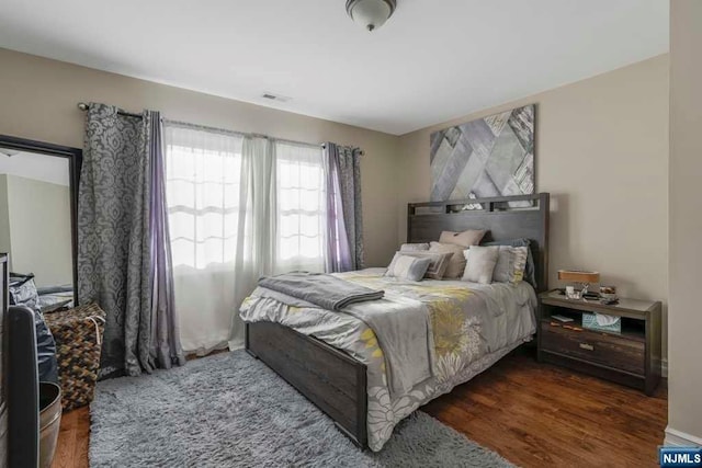 bedroom featuring dark hardwood / wood-style floors