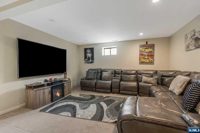 carpeted living room featuring a fireplace