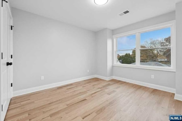 empty room featuring light hardwood / wood-style floors