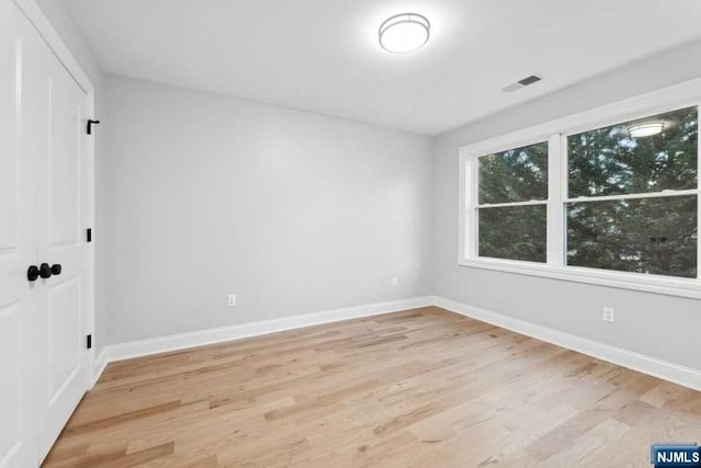 empty room with light wood-type flooring