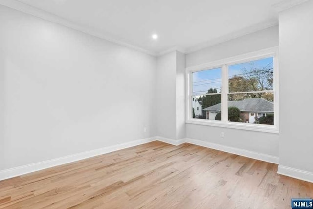 spare room with light hardwood / wood-style floors