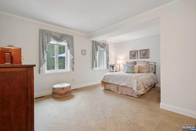 bedroom featuring light colored carpet and ornamental molding