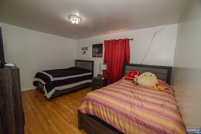 bedroom with light hardwood / wood-style floors