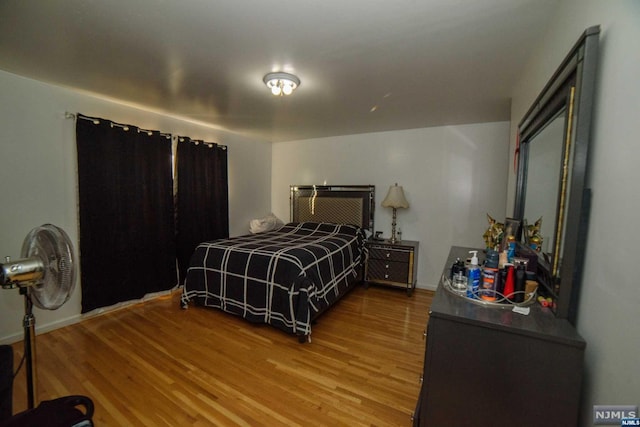 bedroom featuring wood-type flooring