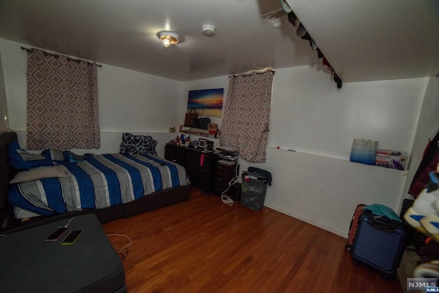 bedroom featuring wood-type flooring