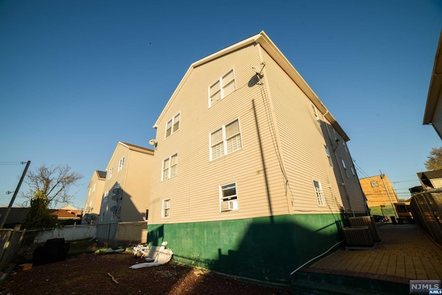 view of home's exterior with cooling unit