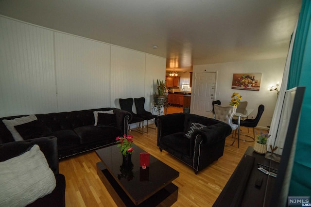 living room featuring light hardwood / wood-style floors and sink