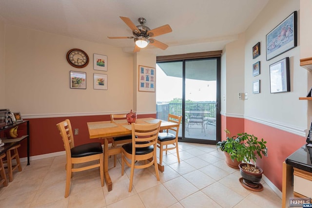 tiled dining area with ceiling fan