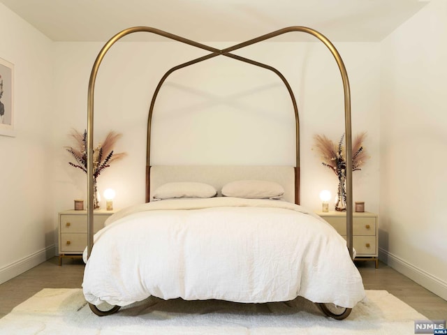 bedroom featuring wood-type flooring