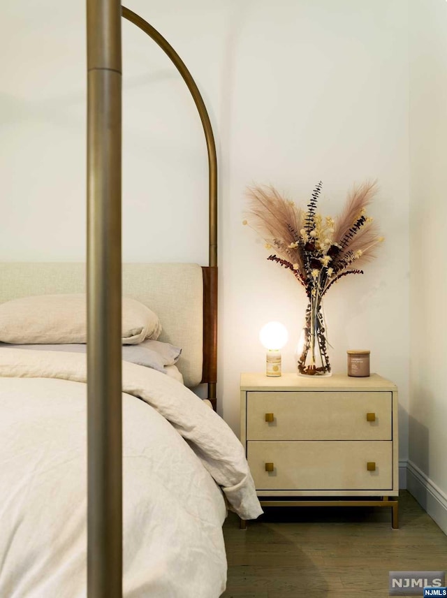 bedroom featuring dark hardwood / wood-style floors