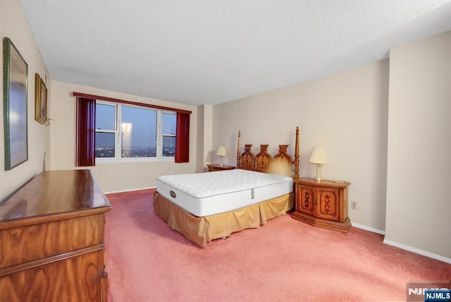 carpeted bedroom with a textured ceiling