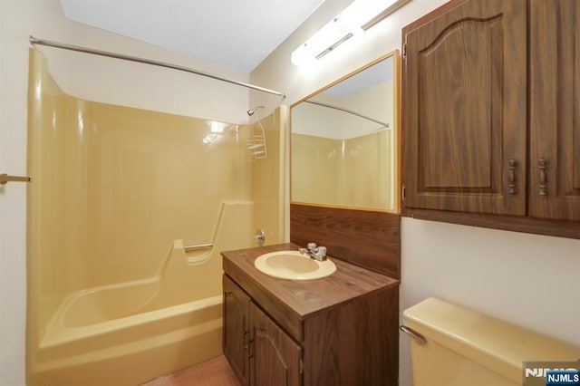 full bathroom with washtub / shower combination, vanity, and toilet