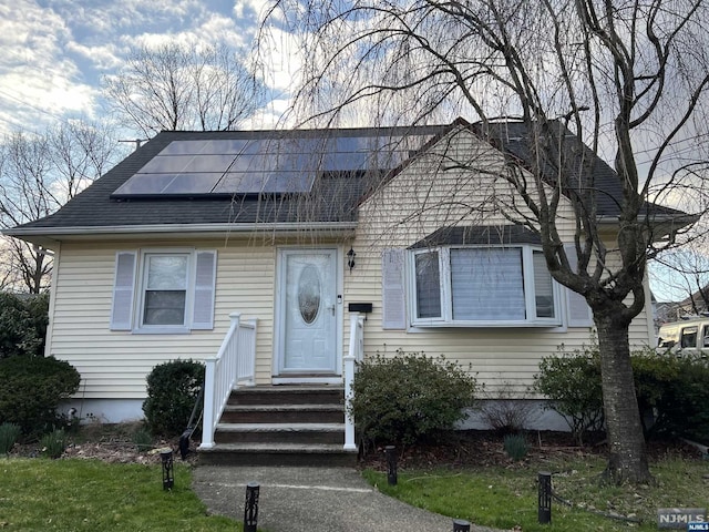 view of front of home featuring solar panels