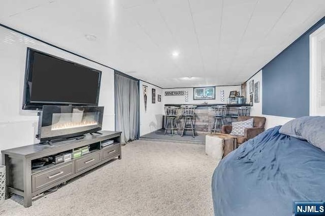 bedroom featuring carpet and bar